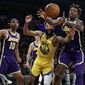 Los Angeles Lakers&#39; Dwight Howard, right, grabs a rebound over Golden State Warriors&#39; Ky Bowman (12) during the first half of an NBA basketball game Wednesday, Nov. 13, 2019, in Los Angeles. (AP Photo/Marcio Jose Sanchez)