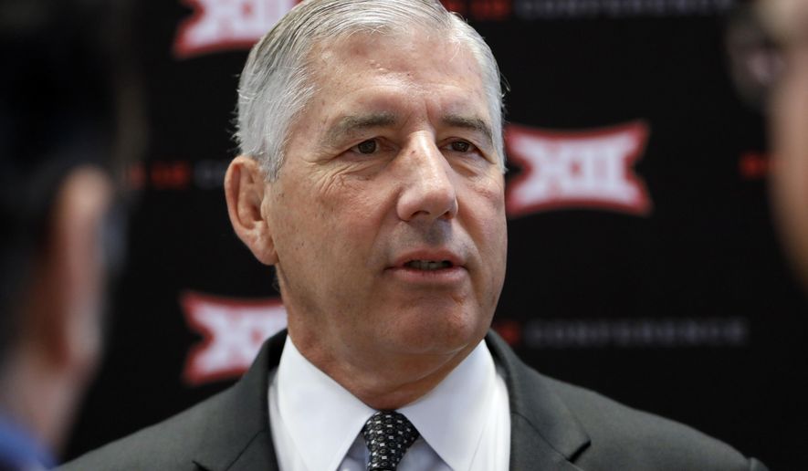 FILE - In this July 15, 2019, file photo, conference commissioner Bob Bowlsby answers questions from reporters after his opening remarks on the first day of Big 12 Conference NCAA college football media days, at AT&T Stadium in Arlington, Texas. Parity in the Big 12 this season makes for good competition but also presents a quandary about the league’s chances of qualifying a team for the College Football Playoff. Bowlsby says parity “makes it more difficult, there isn’t any question about that.”(AP Photo/David Kent, File)