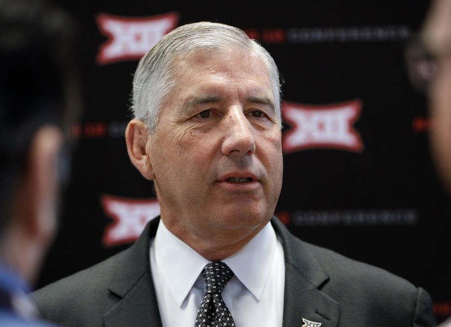 FILE - In this July 15, 2019, file photo, conference commissioner Bob Bowlsby answers questions from reporters after his opening remarks on the first day of Big 12 Conference NCAA college football media days, at AT&T Stadium in Arlington, Texas. Parity in the Big 12 this season makes for good competition but also presents a quandary about the league’s chances of qualifying a team for the College Football Playoff. Bowlsby says parity “makes it more difficult, there isn’t any question about that.”(AP Photo/David Kent, File)