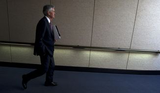 Federal Reserve Board Chair Jerome Powell leaves after the hearing on the economic outlook, on Capitol Hill in Washington, on Wednesday, Nov. 13, 2019. (AP Photo/Jose Luis Magana)