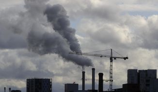 Smoke billows from a plant just outside the French capital, Wednesday, Nov. 13, 2019 in Paris. The world&#39;s thirst for oil will continue to grow until the 2030s, with climate-damaging emissions climbing until at least 2040 — and consumers&#39; insatiable appetite for SUVs is a big reason why. (AP Photo/Michel Euler)