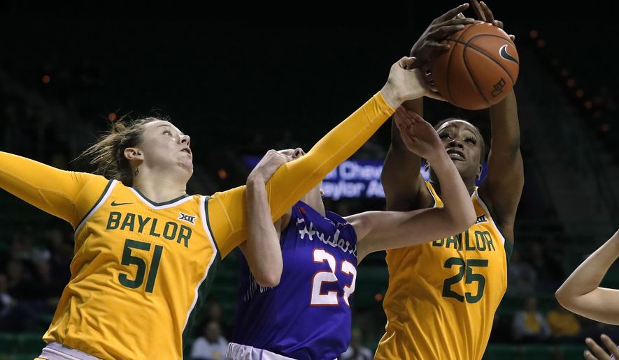 Baylor forward Caitlin Bickle (51) and center Queen Egbo (25) compete against Houston forward Lauren Calver, center, for a rebound during the second half of an NCAA college basketball game in Waco, Texas, Thursday, Nov. 14, 2019. (AP Photo/Tony Gutierrez)