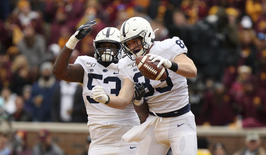 Penn State tight end Nick Bowers (83) celebrates with teammate offensive lineman Rasheed Walker (53) after Bowers scored a touchdown during an NCAA college football game against Minnesota, Saturday, Nov. 9, 2019, in Minneapolis. Minnesota won 31-26. (AP Photo/Stacy Bengs)