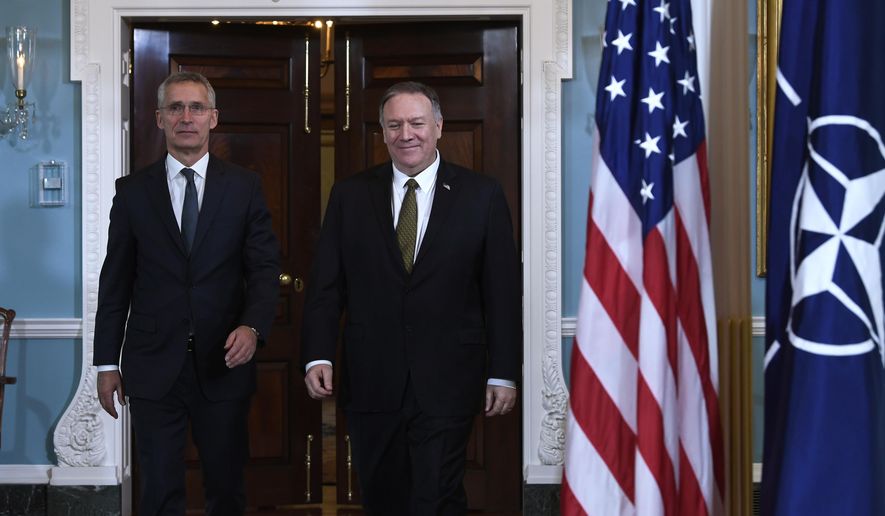 Secretary of State Mike Pompeo, right, and NATO Secretary General Jens Stoltenberg, left, walk together for a photo opportunity at the State Department in Washington, Thursday, Nov. 14, 2019. (AP Photo/Susan Walsh)