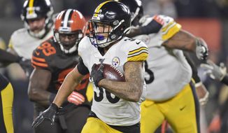 Pittsburgh Steelers running back James Conner (30) rushes against the Cleveland Browns during the first half of an NFL football game Thursday, Nov. 14, 2019, in Cleveland. (AP Photo/David Richard)