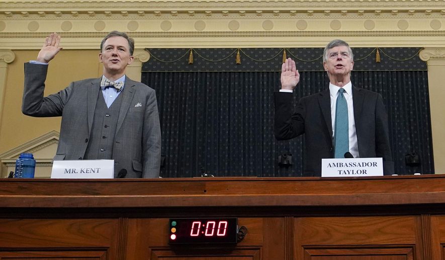 Career Foreign Service officer George Kent and top U.S. diplomat in Ukraine William Taylor, right, are sworn in to testify during the first public impeachment hearing of the House Intelligence Committee on Capitol Hill, Wednesday Nov. 13, 2019, in Washington. (Joshua Roberts/Pool via AP)