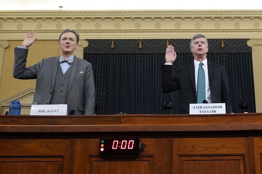 Career Foreign Service officer George Kent and top U.S. diplomat in Ukraine William Taylor, right, are sworn in to testify during the first public impeachment hearing of the House Intelligence Committee on Capitol Hill, Wednesday Nov. 13, 2019, in Washington. (Joshua Roberts/Pool via AP)