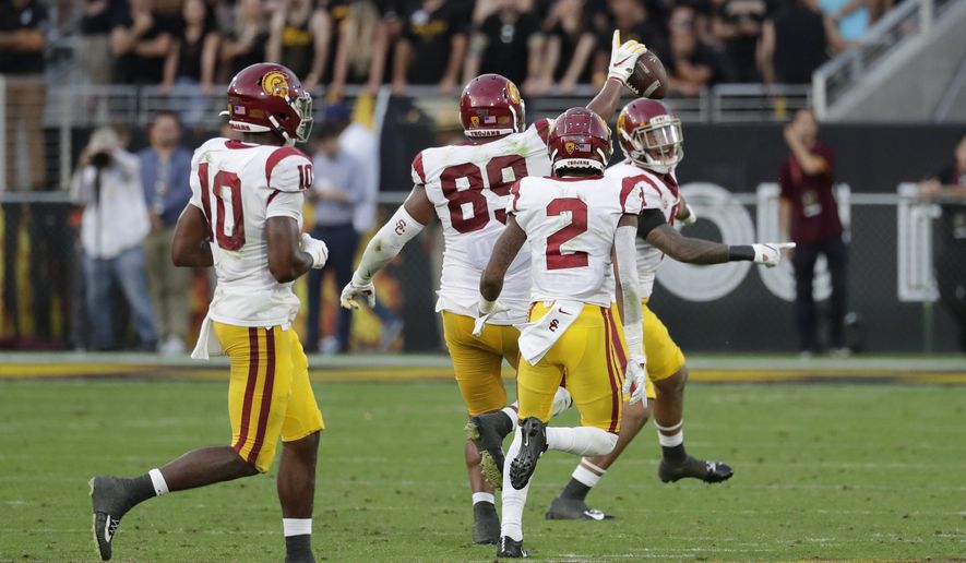 Southern California defensive lineman Christian Rector (89) celebrates his game-ending interception against Arizona State during the second half of an NCAA college football game, Saturday, Nov. 9, 2019, in Tempe, Ariz. (AP Photo/Matt York)