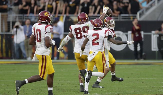 Southern California defensive lineman Christian Rector (89) celebrates his game-ending interception against Arizona State during the second half of an NCAA college football game, Saturday, Nov. 9, 2019, in Tempe, Ariz. (AP Photo/Matt York)