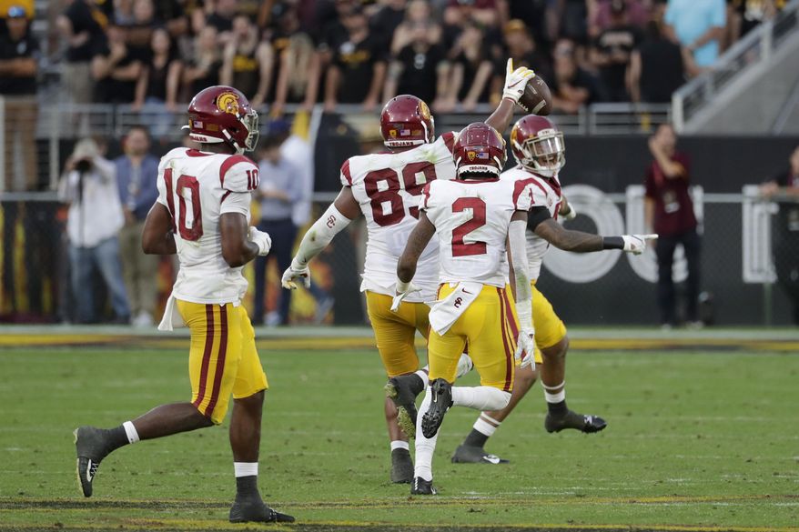 Southern California defensive lineman Christian Rector (89) celebrates his game-ending interception against Arizona State during the second half of an NCAA college football game, Saturday, Nov. 9, 2019, in Tempe, Ariz. (AP Photo/Matt York)