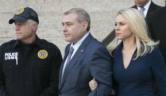 Lev Parnas leaves his arraignment with his wife, Svetlana Parnas, Wednesday, Oct. 23, 2019 in New York. He and Igor Fruman are charged with conspiracy to make illegal contributions to political committees supporting President Donald Trump and other Republicans. Prosecutors say the pair wanted to use the donations to lobby U.S. politicians to oust the country&#x27;s ambassador to Ukraine. (AP Photo/Mark Lennihan)