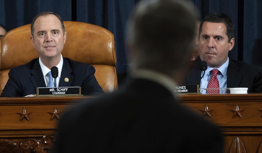 House Intelligence Committee Chairman Rep. Adam Schiff, D-Calif., left, and ranking member Rep. Devin Nunes, R-Calif., watch as Top U.S. diplomat in Ukraine William Taylor leaves after testifying at a hearing of the House Intelligence Committee on Capitol Hill in Washington, Wednesday, Nov. 13, 2019, during the first public impeachment hearing of President Donald Trump&#x27;s efforts to tie U.S. aid for Ukraine to investigations of his political opponents. (Saul Loeb/Pool Photo via AP)