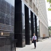 In this July 28, 2015, photo, a man walks past the Export-Import Bank of the United States, in Washington. (AP Photo/Jacquelyn Martin) **FILE**
