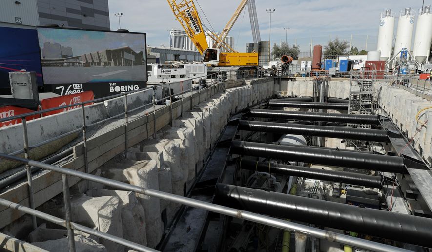 A tunnel boring machine sits at the bottom of a construction site during a media tour at the Las Vegas Convention Center, Friday, Nov. 15, 2019, in Las Vegas. Officials held an event Friday to mark the start of a year-long project by Elon Musk's The Boring Company to drill underground tunnels for a people mover to whisk passengers between stations at the Las Vegas Convention Center. (AP Photo/John Locher)