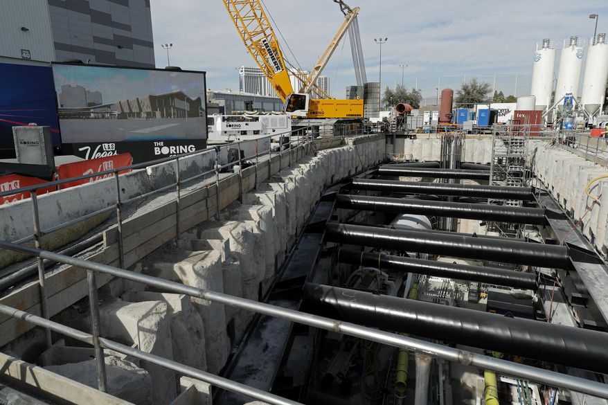 A tunnel boring machine sits at the bottom of a construction site during a media tour at the Las Vegas Convention Center, Friday, Nov. 15, 2019, in Las Vegas. Officials held an event Friday to mark the start of a year-long project by Elon Musk's The Boring Company to drill underground tunnels for a people mover to whisk passengers between stations at the Las Vegas Convention Center. (AP Photo/John Locher)
