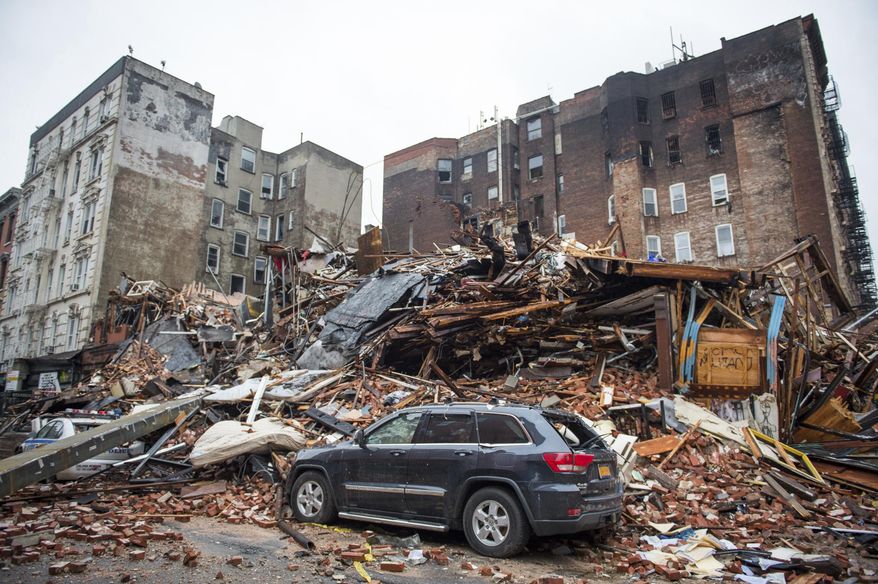 FILE - In this March 27, 2015, file photo, a pile of debris remains at the site of a building explosion in the East Village neighborhood of New York. Three people were convicted of manslaughter, Friday, Nov. 15, 2019, in the 2015 East Village building explosion that killed two men. (Nancy Borowick/The New York Times via AP, Pool)