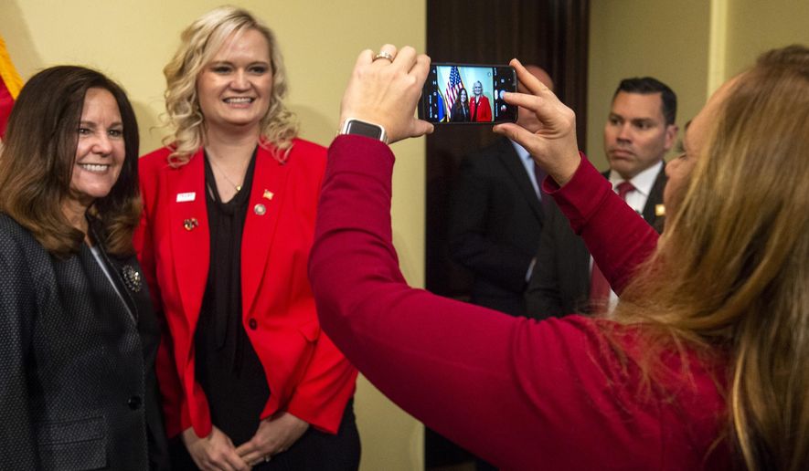 State Sen. Kellie Brown takes a photo of Daniella Harding and Karen Pence Karen Pence, left, wife of Vice President, Friday, Nov. 15, 2019, in Salt Lake City, Utah. (Rick Egan/The Salt Lake Tribune via AP)