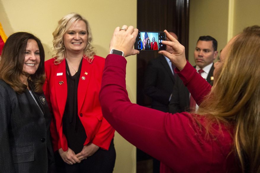 State Sen. Kellie Brown takes a photo of Daniella Harding and Karen Pence Karen Pence, left, wife of Vice President, Friday, Nov. 15, 2019, in Salt Lake City, Utah. (Rick Egan/The Salt Lake Tribune via AP)