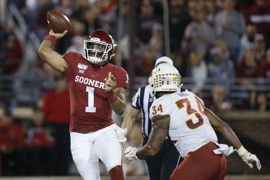 Oklahoma quarterback Jalen Hurts (1) throws under pressure from Iowa State linebacker O'Rien Vance (34) during the third quarter of an NCAA college football game in Norman, Okla., Saturday, Nov. 9, 2019. (AP Photo/Sue Ogrocki)