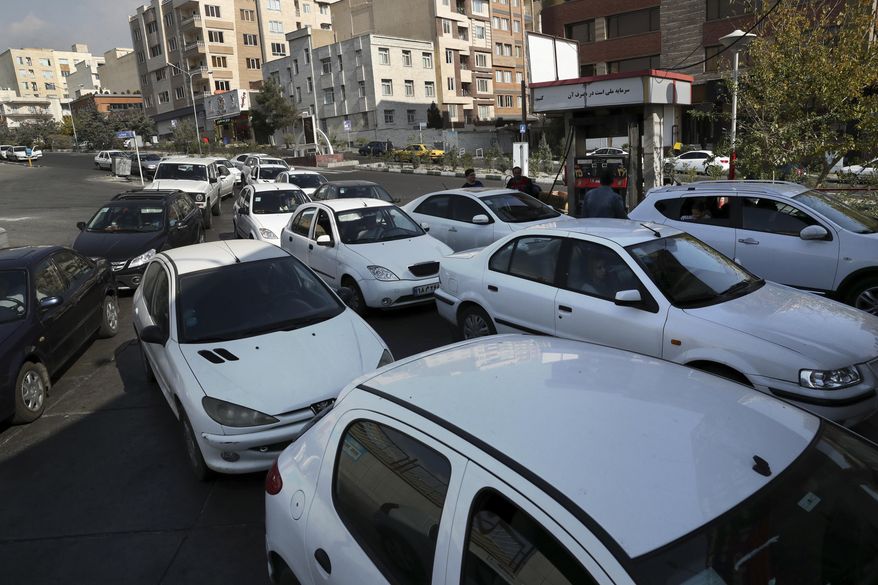 Vehicles queue to enter a gas station in Tehran, Iran, Friday, Nov. 15, 2019. Authorities have imposed rationing and increased the prices of fuel. The decision came following months of speculations about possible rationing after the U.S. in 2018 reimposed sanctions that sent Iran&#39;s economy into free-fall following Washington withdrawal from 2015 nuclear deal between Iran and world powers. (AP Photo/Vahid Salemi)
