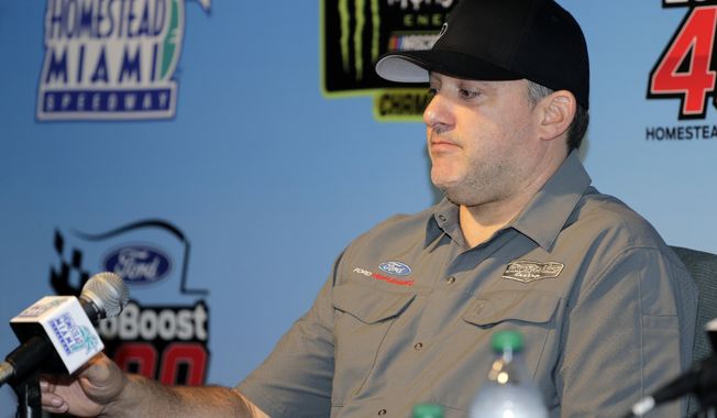 Team owner Tony Stewart takes questions during a NASCAR Cup Series auto race press conference Friday, Nov. 15, 2019, at Homestead-Miami Speedway in Homestead, Fla. Tony Stewart is set to become a NASCAR Hall of Famer. But adding another championship might mean even more.  (AP Photo/Terry Renna)
