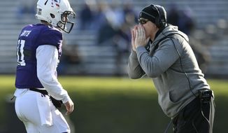 Northwestern head coach Pat Fitzgerald, right, yells to quarterback Aidan Smith (11) during the second half of an NCAA college football game against Purdue, Saturday, Nov. 9, 2019, in Evanston, Ill. Purdue won 24-22. (AP Photo/Paul Beaty)