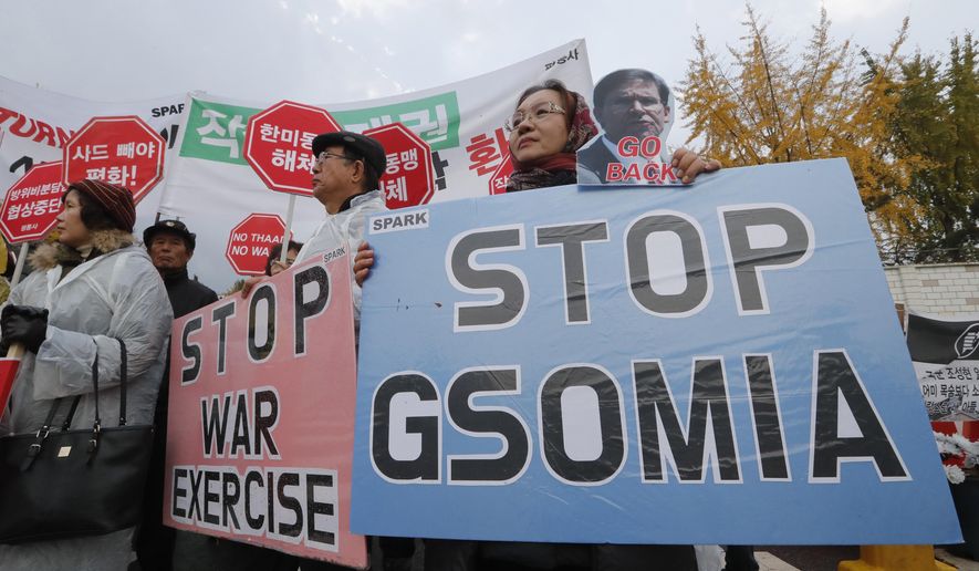 Protesters stage a rally to oppose a visit by U.S. Secretary for Defense Mark Esper in front of the Defense Ministry in Seoul, South Korea, Friday, Nov. 15, 2019. The sign reads &amp;quot;We demand to abolish the General Security of Military Information Agreement, or GSOMIA, an intelligence-sharing agreement between South Korea and Japan.&amp;quot; (AP Photo/Ahn Young-joon)