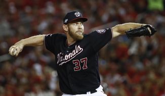 In this Oct. 14, 2019, file photo, Washington Nationals starting pitcher Stephen Strasburg throws during the fifth inning of Game 3 of the baseball National League Championship Series against the St. Louis Cardinals in Washington. The top picks from the 2011 and 2009 drafts are both available this offseason. Gerrit Cole gets the nod over Strasburg because he is two years younger. (AP Photo/Patrick Semansky) ** FILE **