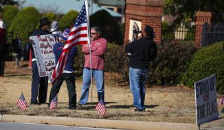 Protesters and supporters show up for a planned Colin Kaepernick workout for NFL football scouts Saturday, Nov. 16, 2019, in Flowery Branch, Ga.. (AP Photo/Todd Kirkland)