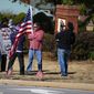 Protesters and supporters show up for a planned Colin Kaepernick workout for NFL football scouts Saturday, Nov. 16, 2019, in Flowery Branch, Ga.. (AP Photo/Todd Kirkland)