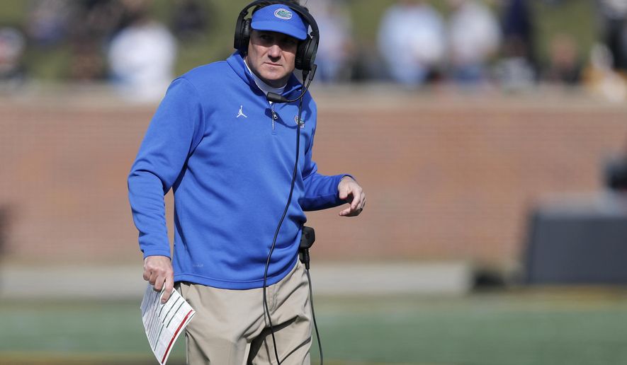 Florida head coach Dan Mullen watches from the sidelines during the first half of an NCAA college football game against Missouri, Saturday, Nov. 16, 2019, in Columbia, Mo. (AP Photo/Jeff Roberson)