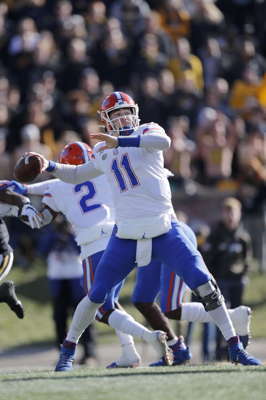Florida quarterback Kyle Trask throws during the first half of an NCAA college football game against Missouri, Saturday, Nov. 16, 2019, in Columbia, Mo. (AP Photo/Jeff Roberson)