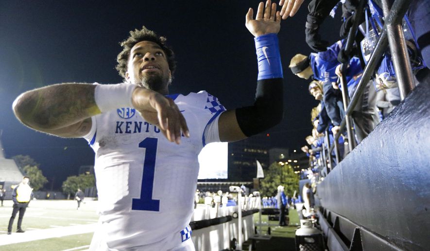 Kentucky's Lynn Bowden Jr. celebrates with fans after an NCAA college football game against Vanderbilt, Saturday, Nov. 16, 2019, in Nashville, Tenn. (AP Photo/Mark Humphrey)