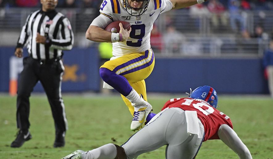 LSU quarterback Joe Burrow (9) avoids Mississippi linebacker Jacquez Jones (10) during the first half of an NCAA college football game in Oxford, Miss., Saturday, Nov. 16, 2019. (AP Photo/Thomas Graning)