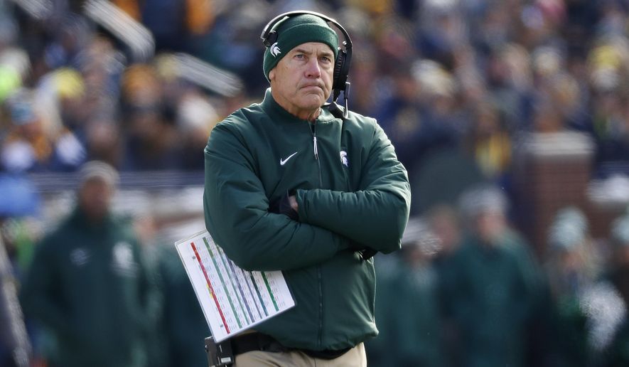 Michigan State head coach Mark Dantonio watches against Michigan in the first half of an NCAA college football game in Ann Arbor, Mich., Saturday, Nov. 16, 2019. (AP Photo/Paul Sancya)