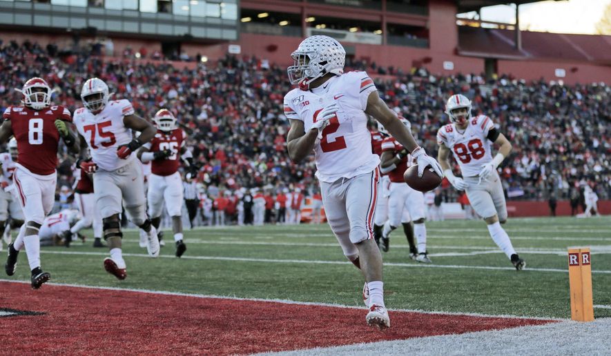 Ohio State running back J.K. Dobbins scores a touchdown against Rutgers during the first half of an NCAA college football game Saturday, Nov. 16, 2019, in Piscataway, N.J. (AP Photo/Adam Hunger)