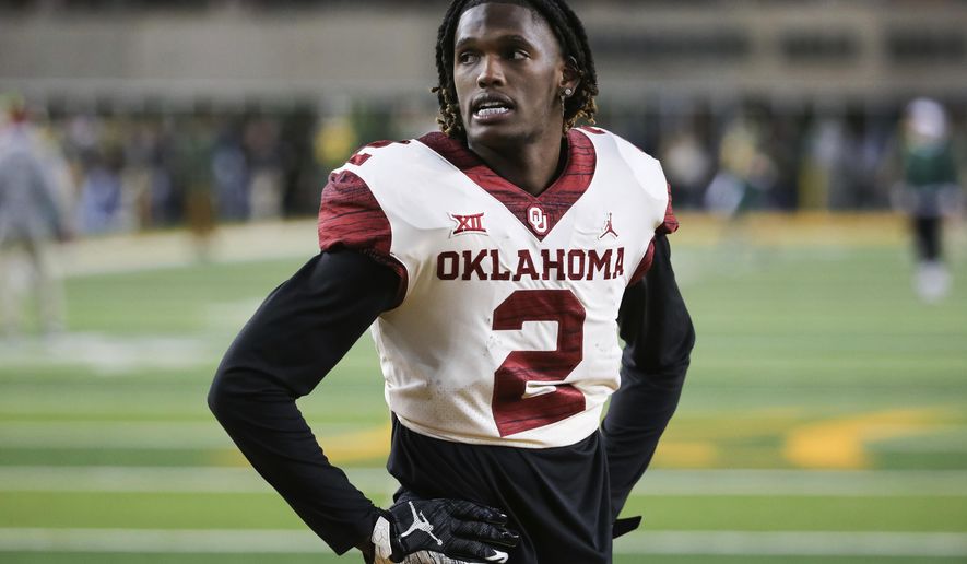Oklahoma wide receiver CeeDee Lamb stands on the field during warmups prior to an NCAA college football game against Baylor in Waco, Texas, Saturday, Nov. 16, 2019. (AP Photo/Ray Carlin)