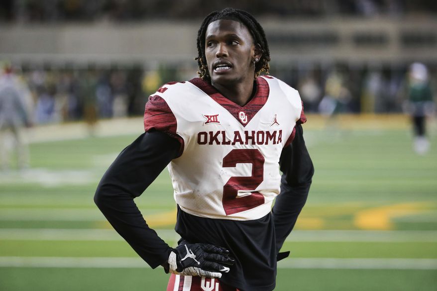 Oklahoma wide receiver CeeDee Lamb stands on the field during warmups prior to an NCAA college football game against Baylor in Waco, Texas, Saturday, Nov. 16, 2019. (AP Photo/Ray Carlin)