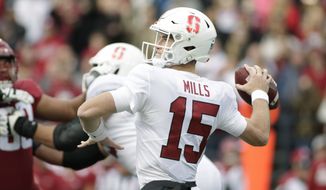 Stanford quarterback Davis Mills (15) throws a pass during the first half of an NCAA college football game against Washington State in Pullman, Wash., Saturday, Nov. 16, 2019. (AP Photo/Young Kwak)