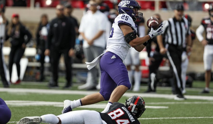 TCU's Wyatt Harris (25) intercepts a pass over Texas Tech's Erik Ezukanma (84) during the first half of an NCAA college football game Saturday, Nov. 16, 2019, in Lubbock, Texas. (Brad Tollefson/Lubbock Avalanche-Journal via AP)