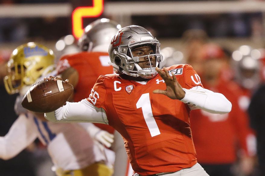 Utah quarterback Tyler Huntley (1) passes the ball against UCLA in the first half during an NCAA college football game Saturday, Nov. 16, 2019, in Salt Lake City. (AP Photo/Rick Bowmer)