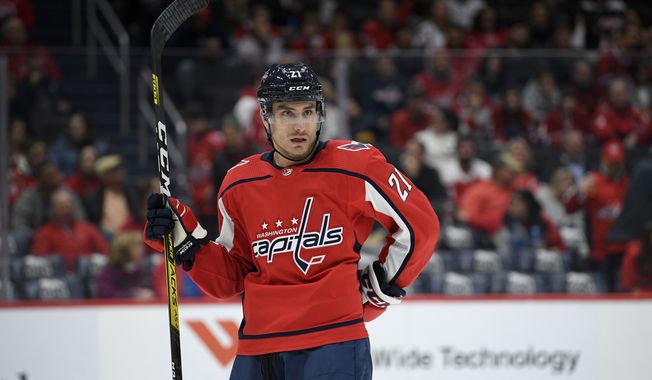 Washington Capitals right wing Garnet Hathaway (21) stands on the ice during the second period of an NHL hockey game against the Montreal Canadiens, Friday, Nov. 15, 2019, in Washington. (AP Photo/Nick Wass) ** FILE **