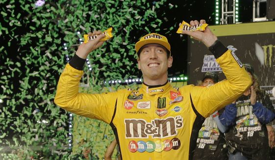 Kyle Busch celebrates in Victory Lane after winning a NASCAR Cup Series auto racing season championship on Sunday, Nov. 17, 2019, at Homestead-Miami Speedway in Homestead, Fla. (AP Photo/Terry Renna) ** FILE **