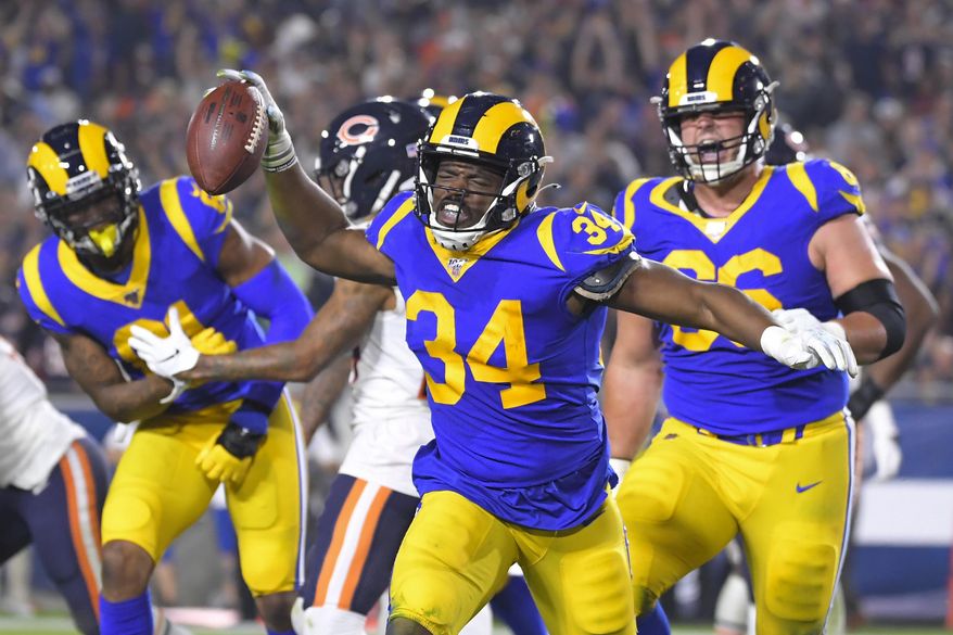 Los Angeles Rams running back Malcolm Brown celebrates after scoring against the Chicago Bears during the second half of an NFL football game Sunday, Nov. 17, 2019, in Los Angeles. (AP Photo/Mark J. Terrill)