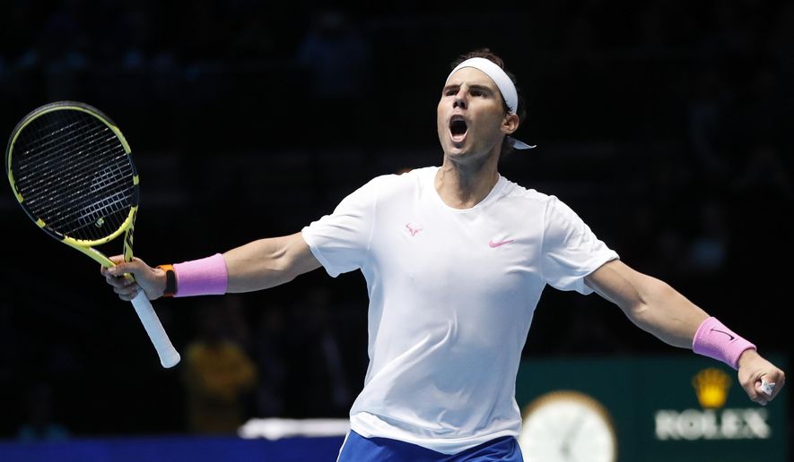 Spain's Rafael Nadal celebrates after defeating Stefanos Tsitsipas of Greece in their ATP World Tours Finals singles tennis match at the O2 Arena in London, Friday, Nov. 15, 2019. (AP Photo/Alastair Grant)