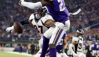Minnesota Vikings safety Jayron Kearse, right, breaks up a pass intended for Denver Broncos tight end Noah Fant (87) in the end zone during the second half of an NFL football game, Sunday, Nov. 17, 2019, in Minneapolis. The Vikings won 27-23. (AP Photo/Bruce Kluckhohn)