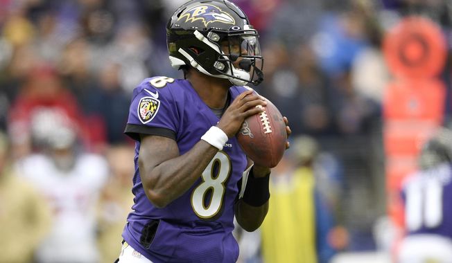 Baltimore Ravens quarterback Lamar Jackson looks to pass against the Houston Texans during the first half of an NFL football game, Sunday, Nov. 17, 2019, in Baltimore. (AP Photo/Nick Wass)