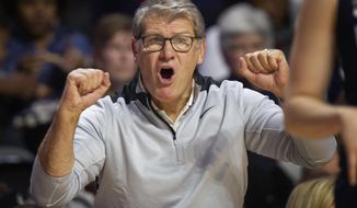 Connecticut head coach Geno Auriemma shouts from the sideline during the second half of an NCAA college basketball game against Temple Sunday, Nov. 17, 2019, in Philadelphia. Connecticut won 83-54. (AP Photo/Laurence Kesterson)