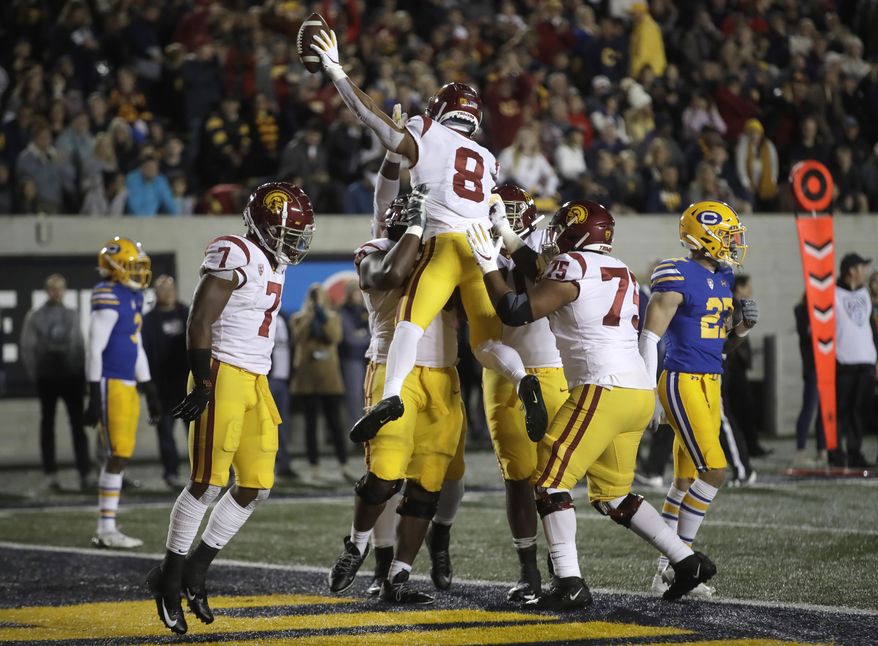Southern California's Amon-Ra St. Brown (8) celebrates after scoring a touchdown against California during the first quarter of an NCAA college football game Saturday, Nov. 16, 2019, in Berkeley, Calif. (AP Photo/Ben Margot)