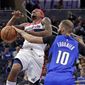 Orlando Magic&#x27;s Evan Fournier (10) knocks the ball away from Washington Wizards&#x27; Bradley Beal as he goes up for a shot during the first half of an NBA basketball game, Sunday, Nov. 17, 2019, in Orlando, Fla. (AP Photo/John Raoux) ** FILE **